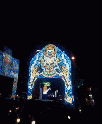 a painting of a monkey is projected onto a building
