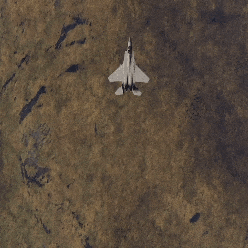 a fighter jet is flying through the air with smoke coming out of it