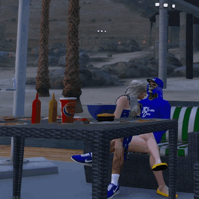 a man and a woman sit at a table with a pepsi cup on it