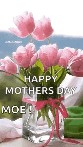 a vase filled with pink flowers with the words `` happy mothers day moe '' on it .