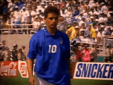 a soccer player wearing a blue shirt with the number 10 on it