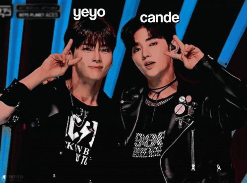 two boys are posing for a picture and one of them has the name yeyo on his face