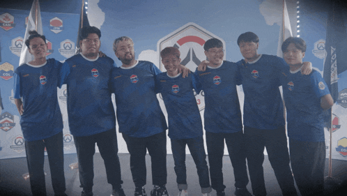 a group of men are posing for a photo in front of a wall that says ' usa ' on it