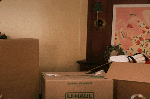 a cardboard box that says u-haul on the front