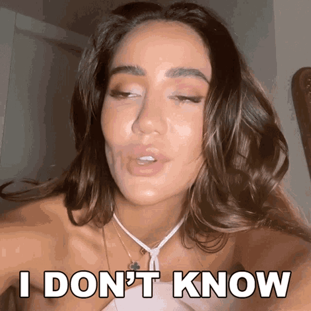 a woman with her eyes closed and the words i don 't know behind her