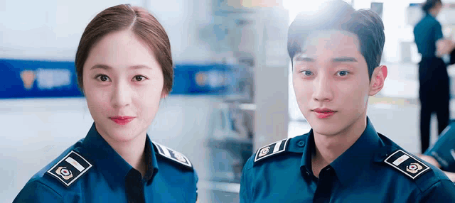a man and a woman wearing police uniforms with the letter i on the shoulder pads