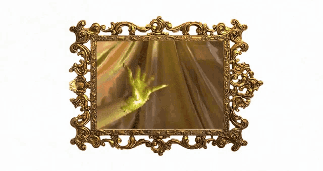 a gold picture frame with a hand in it