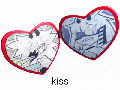 a heart shaped mirror with the word kiss written below it