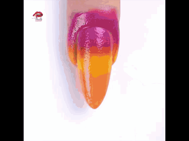 a close up of a woman 's nail with a purple and orange gradient