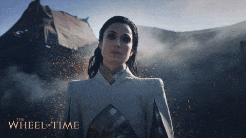 a poster for the wheel of time shows a woman holding a book