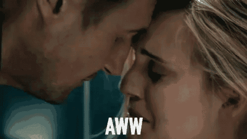 a man and a woman are touching their foreheads and the woman is saying `` aww '' .