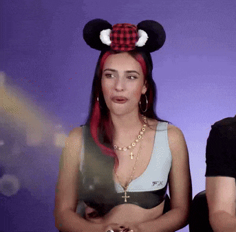 a woman wearing a mickey mouse ear headband