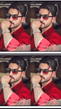 a man wearing sunglasses and a red shirt has his hand on his chin