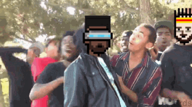 a group of people are gathered in a park with a pixelated image of a man in a hoodie