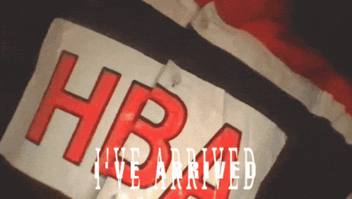 a red and white sign that says hbra live arrived on it