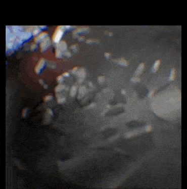 a blurred image of a person 's face with a few spots of light