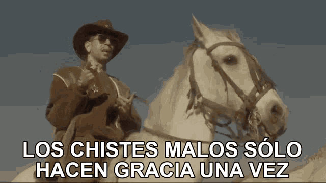 a man in a cowboy hat is riding a white horse with the words los chistes malos solo hacen gracia una vez above him