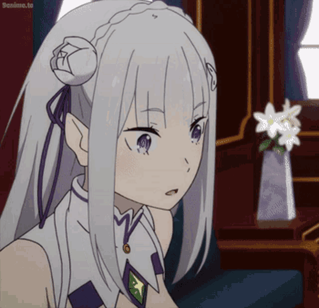 a white haired anime girl with purple eyes is sitting in front of a vase of flowers