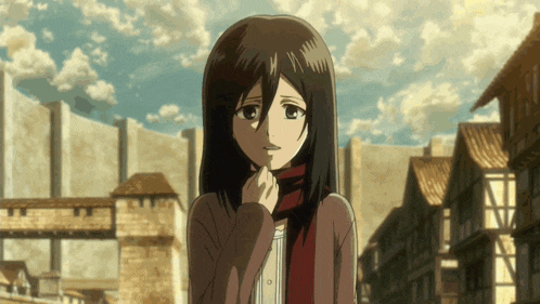 a girl with a scarf around her neck is standing in front of a building