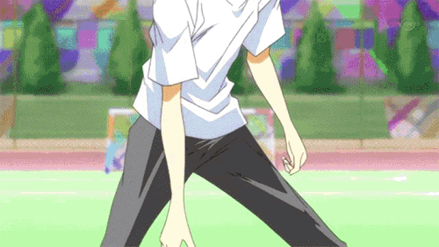 a man in a white shirt and black pants stands on a green field