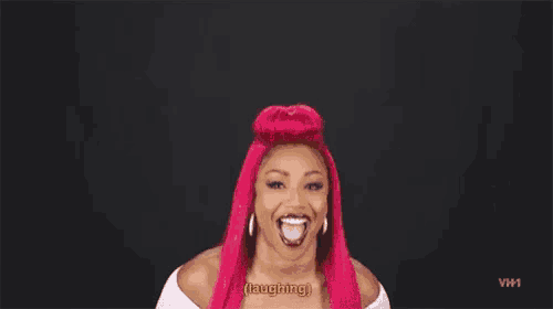 a woman with pink hair is laughing with her mouth open and says `` laughing '' .