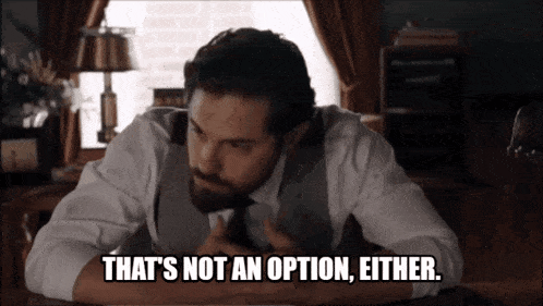 a man is sitting at a desk with the words that 's not an option either