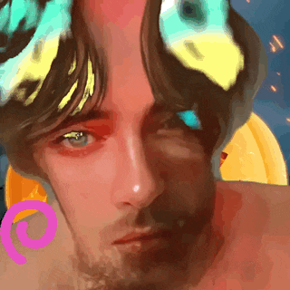 a close up of a man 's face with a pink circle around his neck