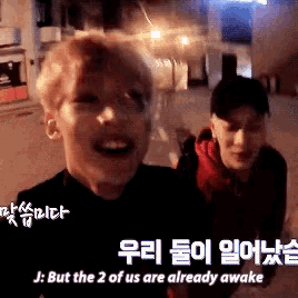 two men are standing next to each other and one of them says but the 2 of us are already awake .