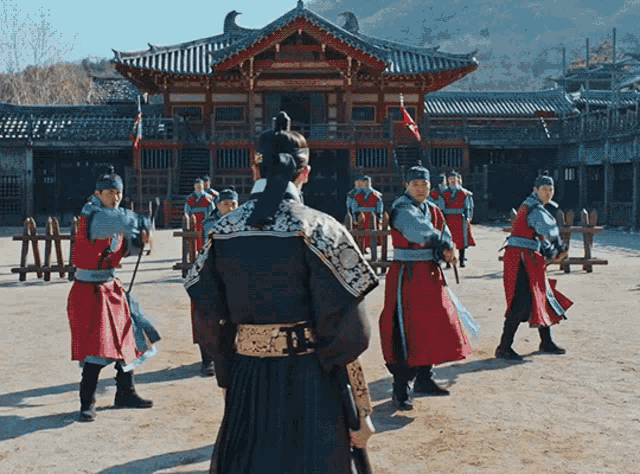 a group of soldiers are standing in front of a building with chinese writing on it