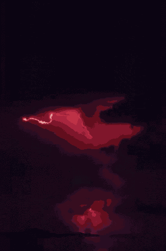 a red lightning bolt strikes the ground in a dark cloudy sky