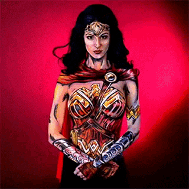 a woman with her body painted to look like wonder woman .