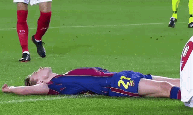 a soccer player with the number 27 on his shorts