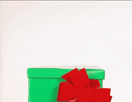 a cartoon reindeer wearing a santa hat is peeking out of a green christmas present box .