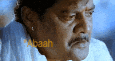 a close up of a man 's face with the word abaah written on it