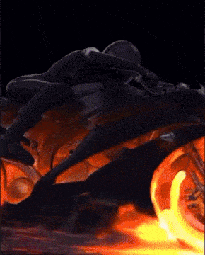 a person is riding a motorcycle with flames coming out of it