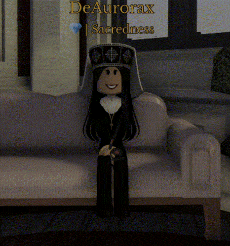 a video game character is sitting on a couch with the name deaurorax sacredness written above her
