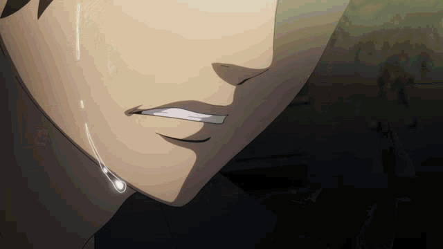 a close up of a person 's mouth with a tear coming out of it