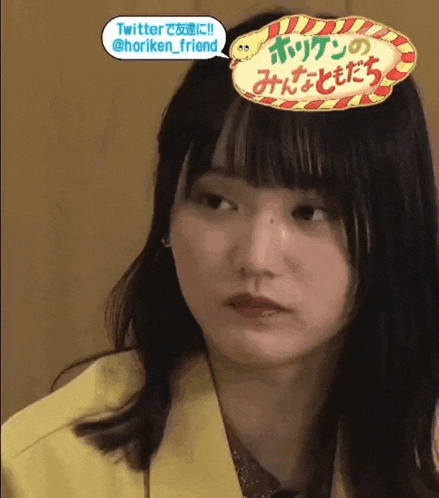 a close up of a woman 's face with a speech bubble that says twitter @horiken_friend