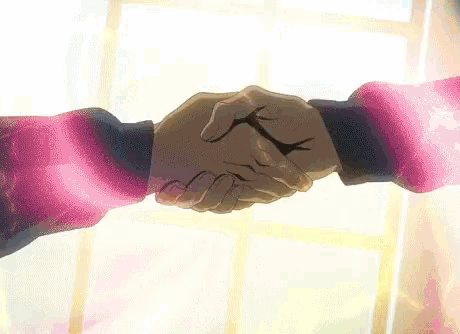 two people are shaking hands in front of a window