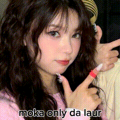 a girl in a pink shirt is making a peace sign with her fingers and the words moka only da laur written below her