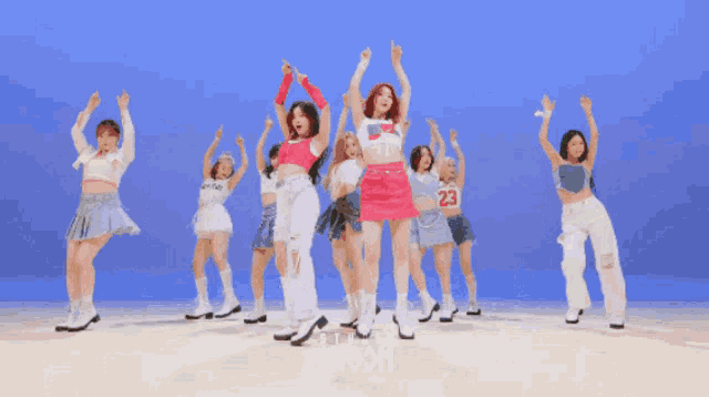 a group of women are dancing in front of a blue background with the word choom on it