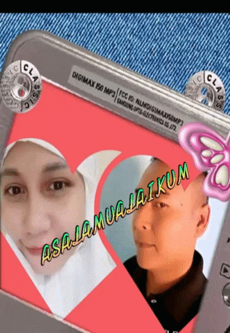 a digimax 150 mp3 phone with a picture of a man and a woman