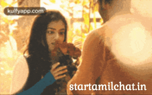 a man and a woman are standing next to each other and the website startamilechat.in is displayed