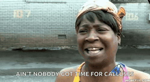 a woman is smiling with the words ain 't nobody got time for calluses