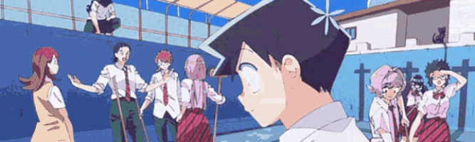 a group of people are standing around a boy in a white shirt
