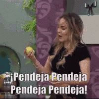 a woman is holding a lemon and says " pendeja pendeja pendeja "