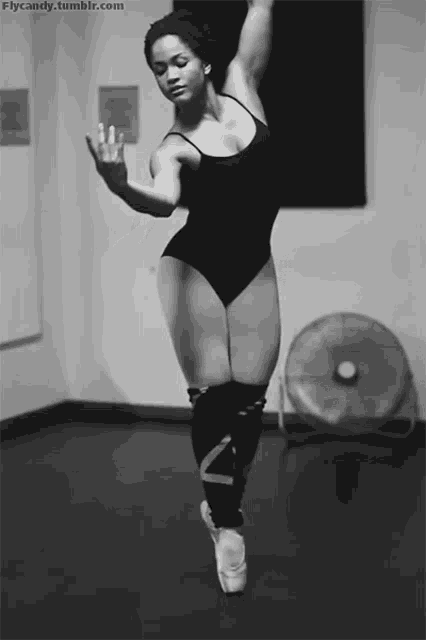 a black and white photo of a ballerina with the website flycandy.tumblr.com visible in the corner