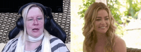 a woman wearing headphones is sitting in a chair next to a woman wearing headphones .