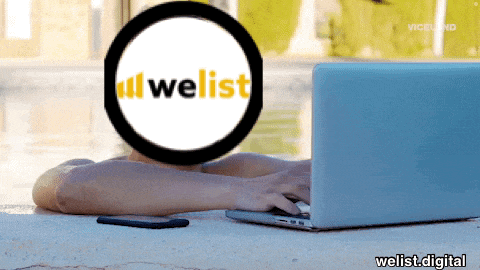 a person is typing on a laptop with a welist logo in the background