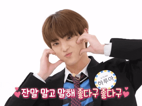 a boy in a suit and tie has a name tag that says a team
